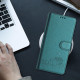 For Samsung Galax S23+ 5G Cat Rat Embossed Pattern RFID PU Phone Case with Wrist Strap(Peacock Green)