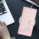 For Samsung Galax S24+ 5G Cat Rat Embossed Pattern RFID PU Phone Case with Wrist Strap(Pink)