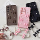 For Samsung Galaxy S24+ 5G Soft Silicone 3D Bowknot Pearl Phone Case with Beaded Wrist Strap(Coffee)